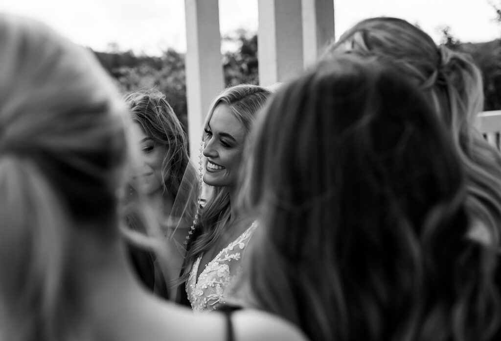 Bride talks to her Bridesmaids in Documentary Photo