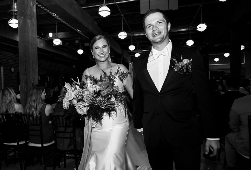 BW Groom and Bride walk out from wedding ceremony