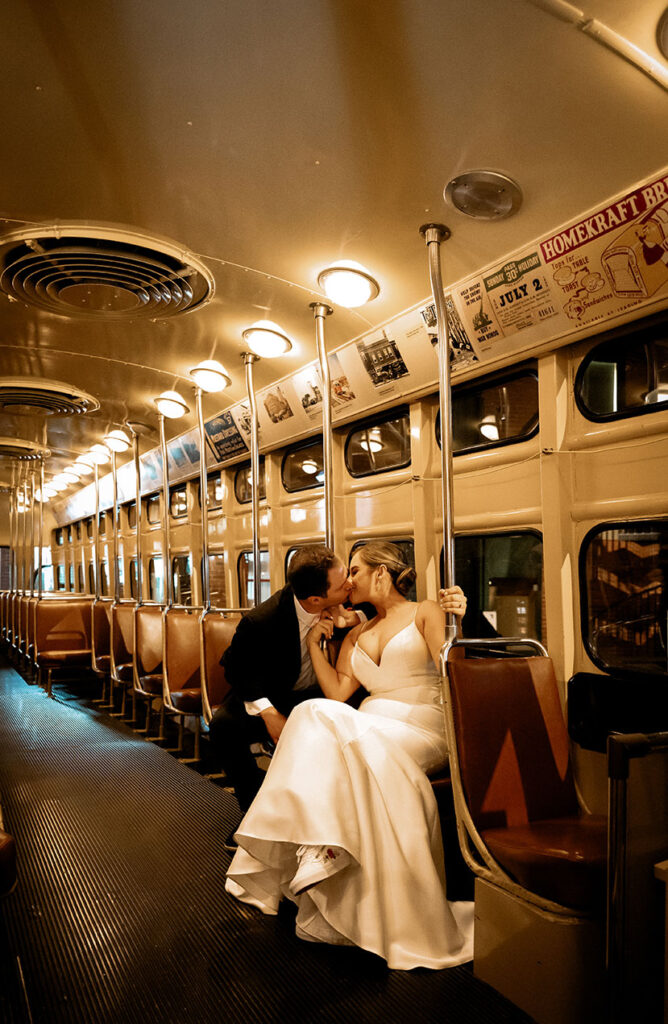 Bride and Groom kiss at Pittsburgh Trolly in Great Hall