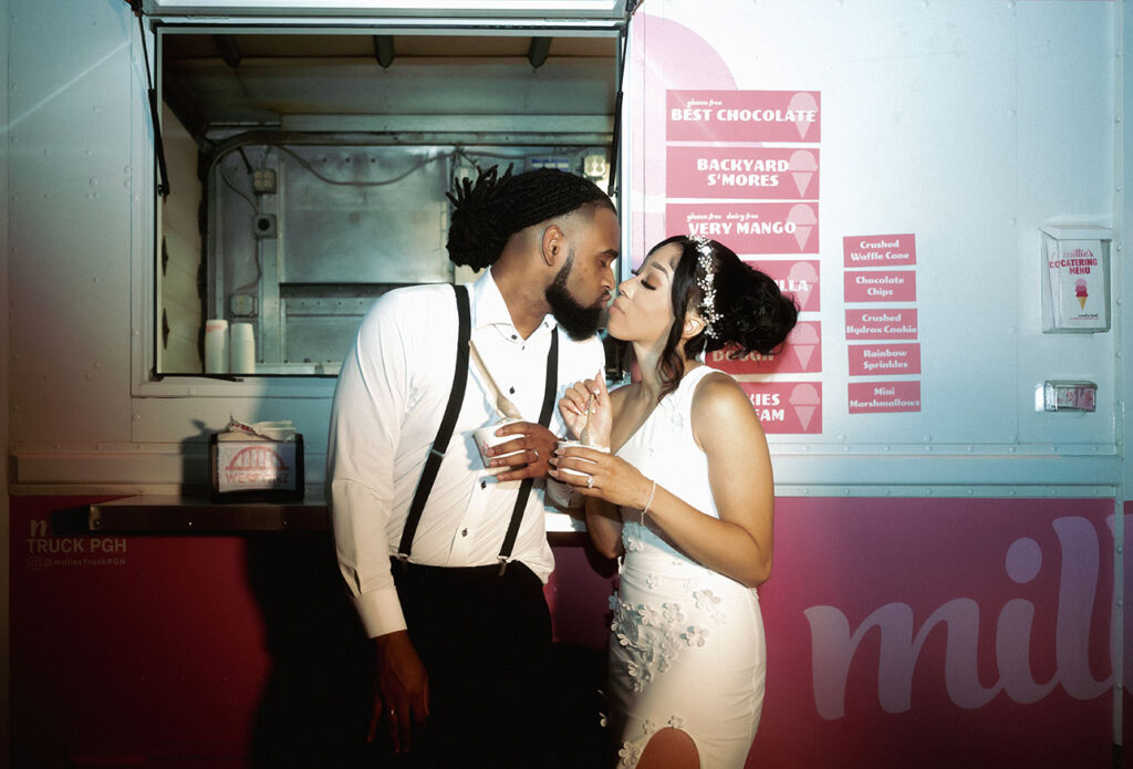 Bride and Groom kiss in front of Millie's Ice Cream Truck