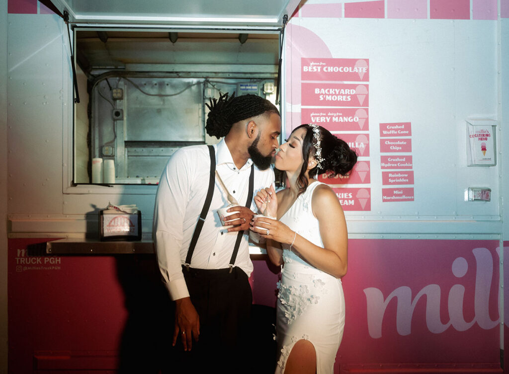 Bride and Groom kiss in front of Millie's Ice Cream Truck