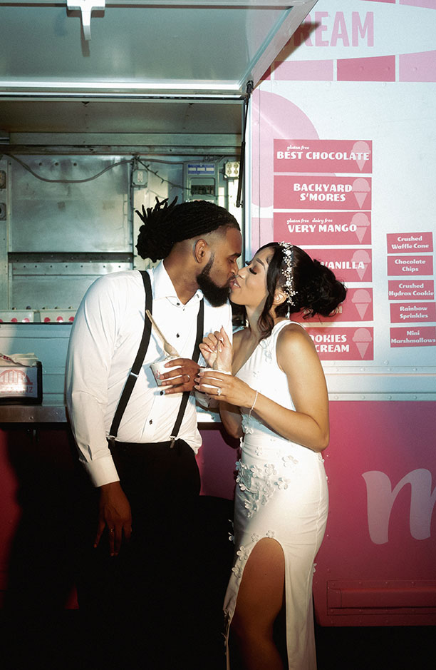 Bride and Groom kiss in front of Millie's Ice Cream Truck