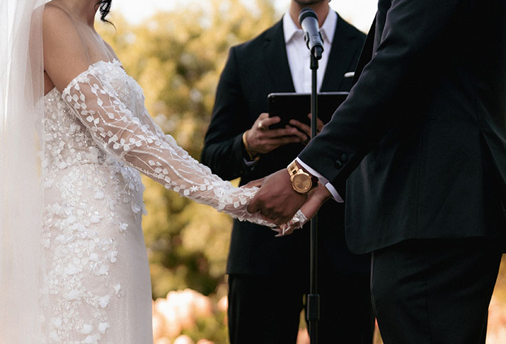 Bride and Groom hold hands at Phipps Wedding