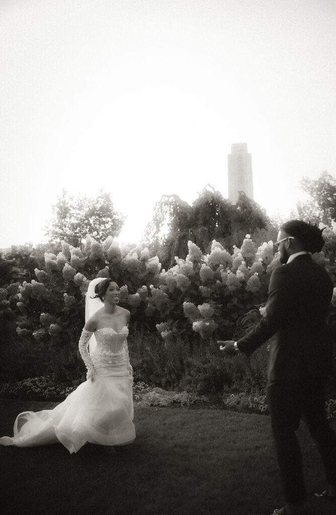 Bride running towards groom at Phipps Garden