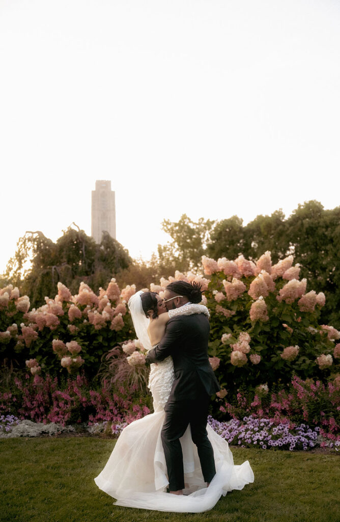 Bride and groom kiss at Phipps garden