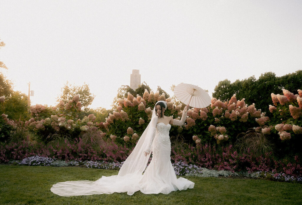 Bride Holding umbrella at Phipps Wedding