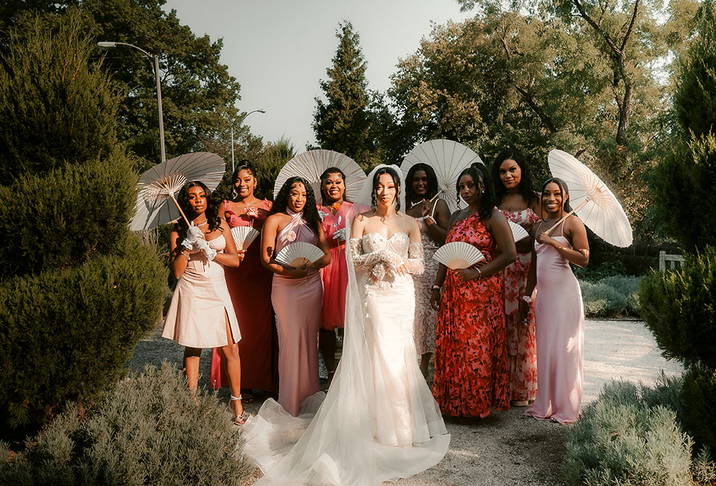 Bridesmaids holding Umbrellas at Phipps Wedding