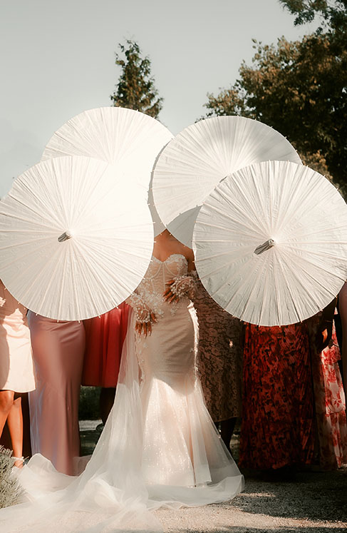 Bridesmaids holding Umbrellas at Phipps Wedding