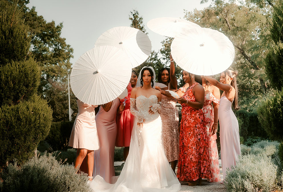 Bridesmaids holding Umbrellas at Phipps Wedding