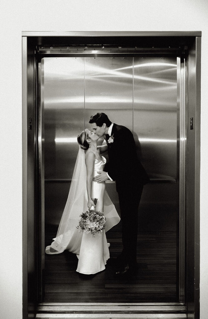 Bride and Groom Kiss at the Andy Warhol Museum's Elevator