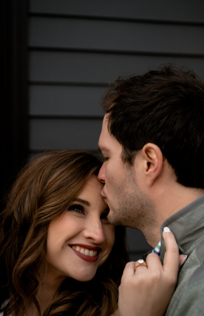 Couple kiss in Pittsburgh Mexican War Streets During their Engagement