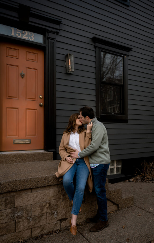 Couple kiss in Pittsburgh Mexican War Streets During their Engagement