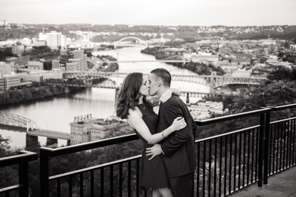 Couple Kissing in front at Grandview Overlook in Mount Washington in front of city of Pittsburgh.