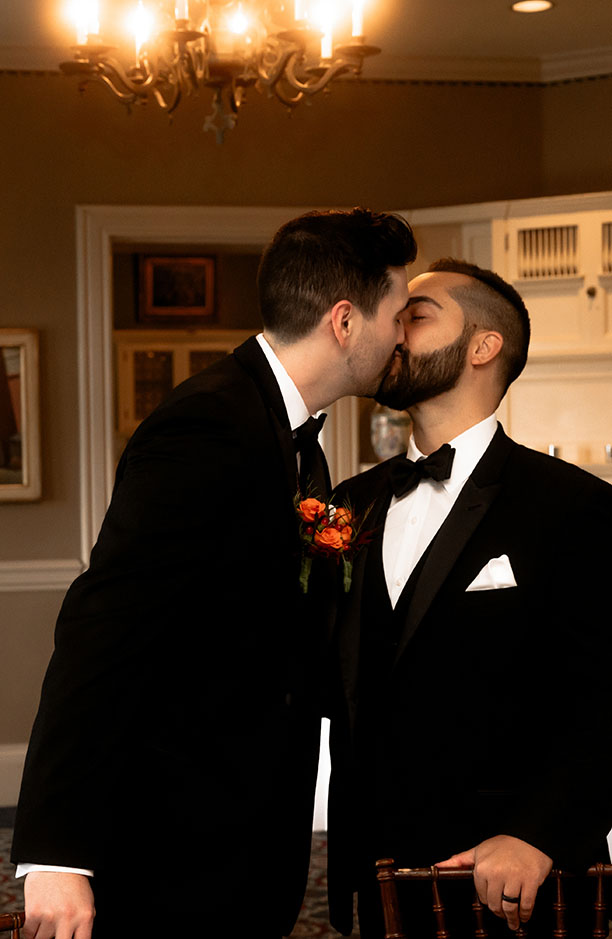 Groom kisses Groom at Shelby Club Wedding