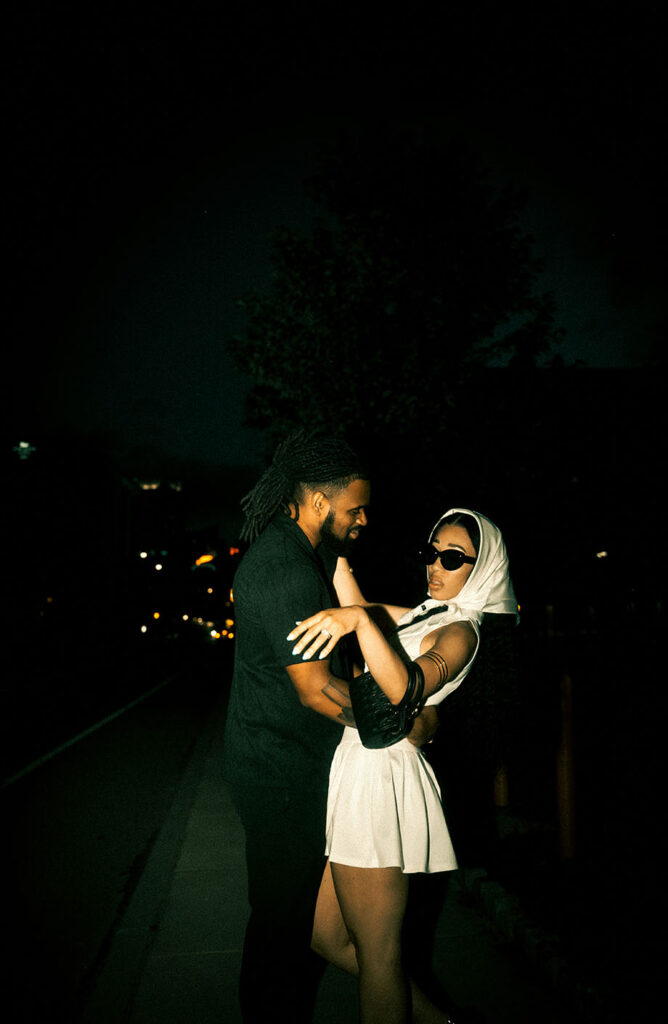 Couple embracing each other in the strip district in Pittsburgh