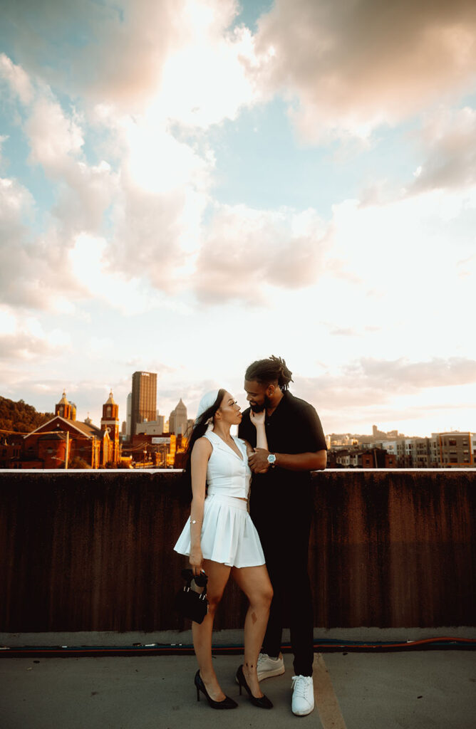 Couple Looking at each other against Pittsburgh Skyline