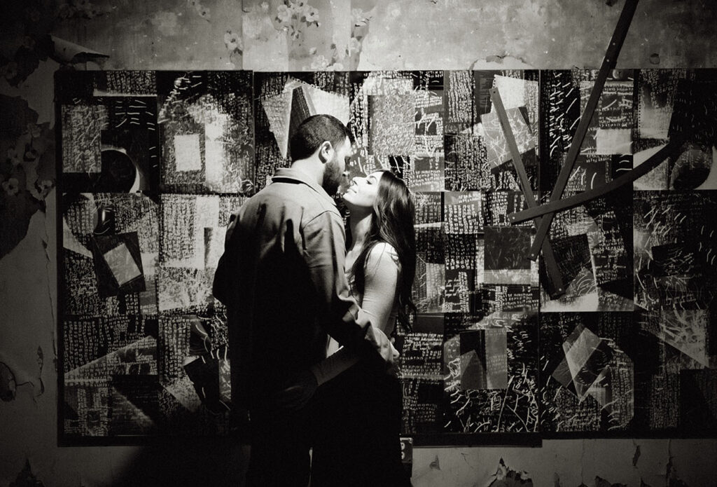 BW Couple hugging about to kiss at The Mattress Factory Museum in Pittsburgh