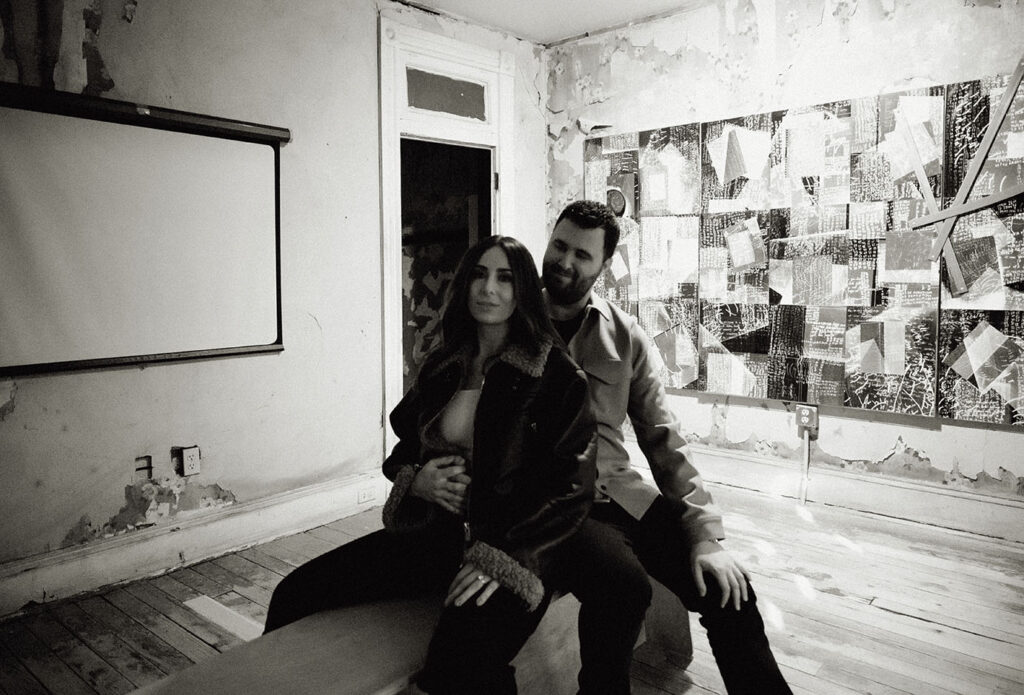 BW Couple about to kiss sitting in Mattress Factory Museum