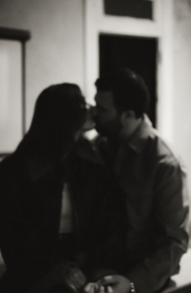 BW Couple about to kiss sitting in Mattress Factory Museum