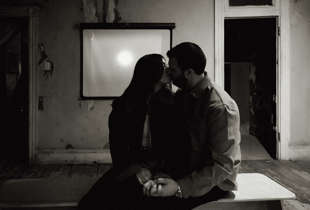 BW Couple about to kiss sitting in Mattress Factory Museum