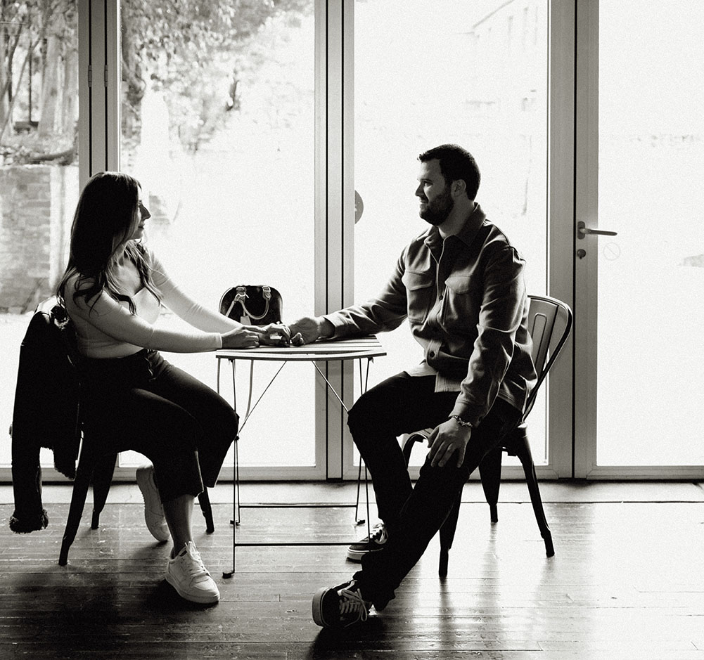 Couple Sitting at Mattress Factory Museum Lobby holding hands