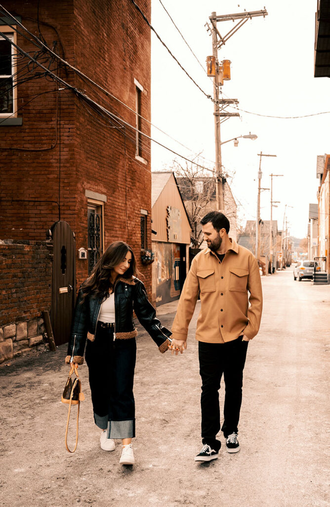 Couple Walk holding hands in the Mexican War Streets in Pittsburgh