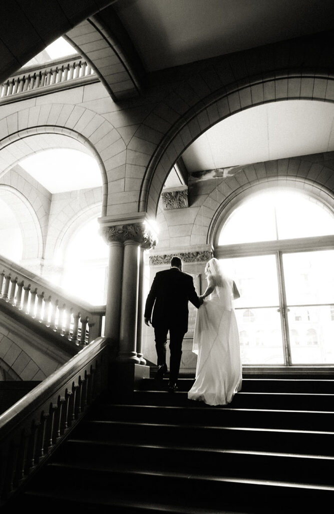 Bride and Groom Walking up the stairs at their Elopement