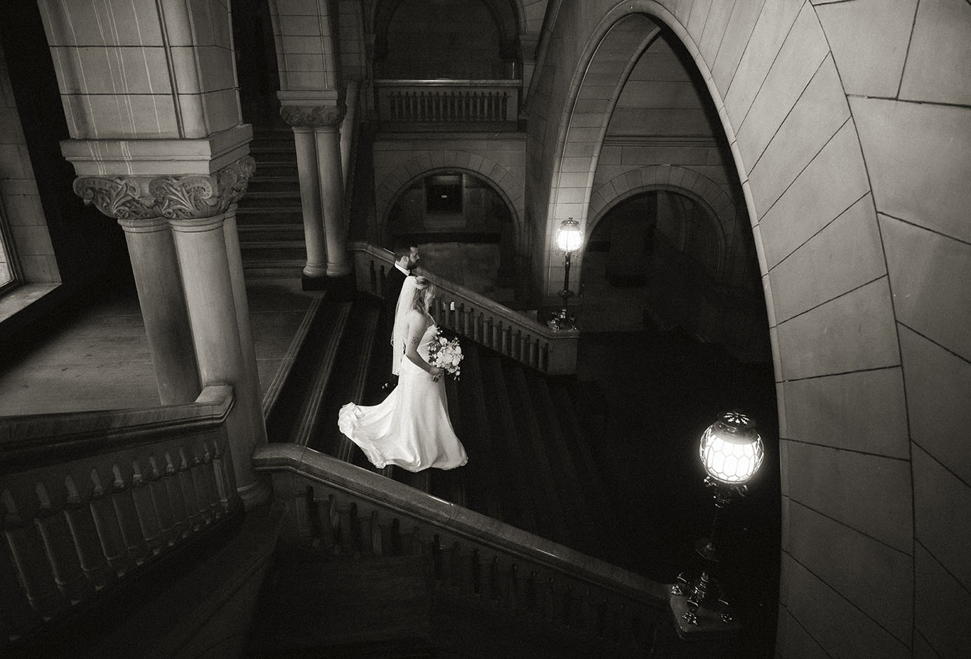 Couple Going down the staircase of the Allegheny Courthouse