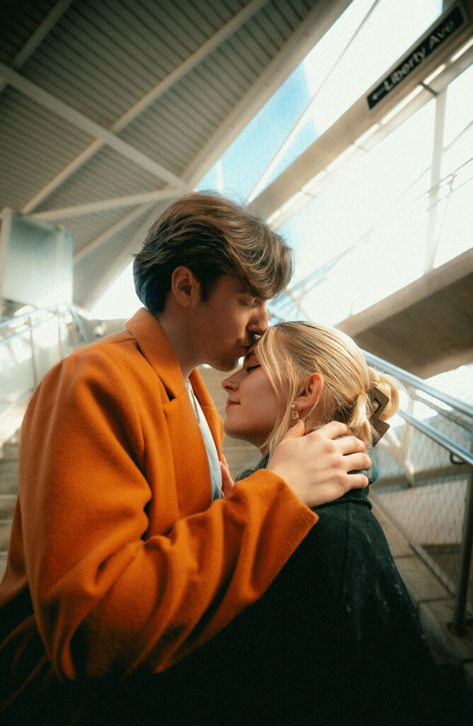 Man Kisses fiance's Forehead At Subway Station