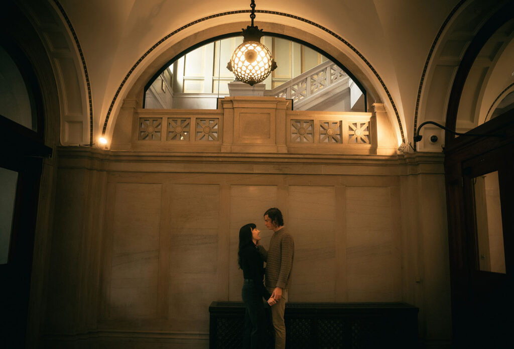 Couple Stand at Carnegie Library main's Entrance