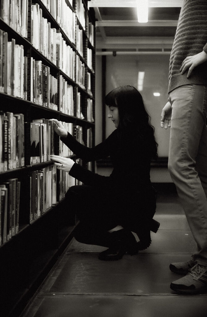 Girl looks up books at Carnegie Library