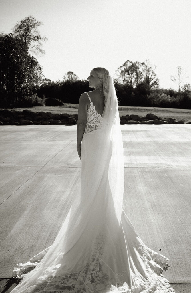 Bride showing off the back of her wedding gown