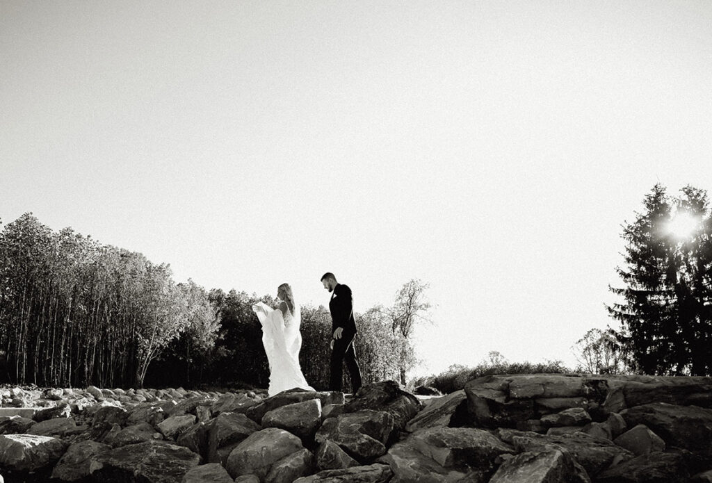 Bride and Groom Walking in the rocks at yinzer valley farms hill