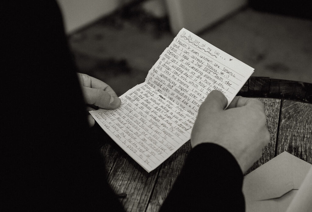 Groom holds a letter