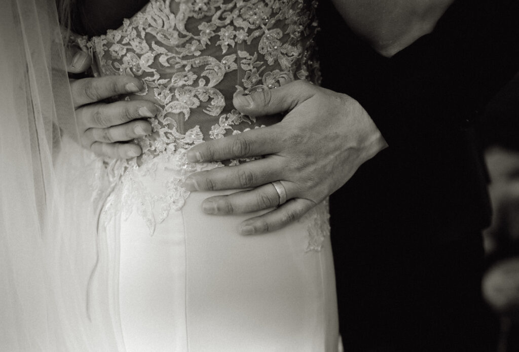 Groom Holding Bride's waist