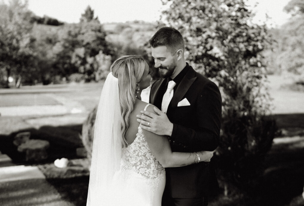 Bride and Groom looking at each other at yinzer valley farms