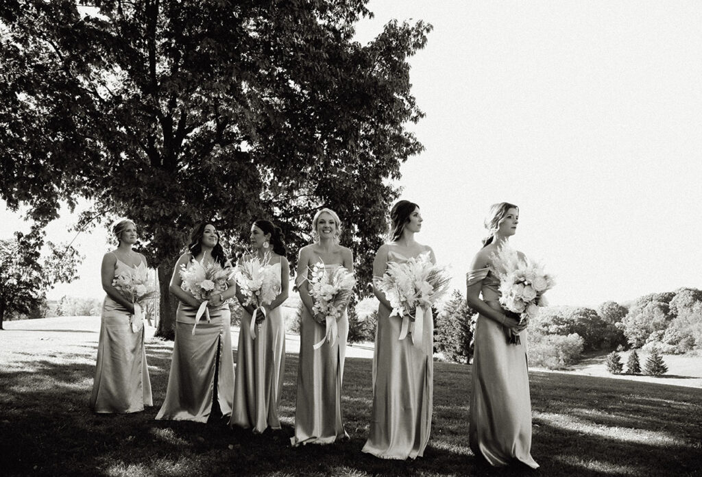 Bridesmaids standing at yinzer valley farms Wedding