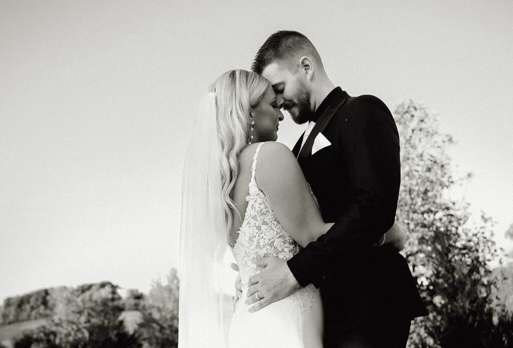 Bride and Groom Touching Foreheads at yinzer valley farms