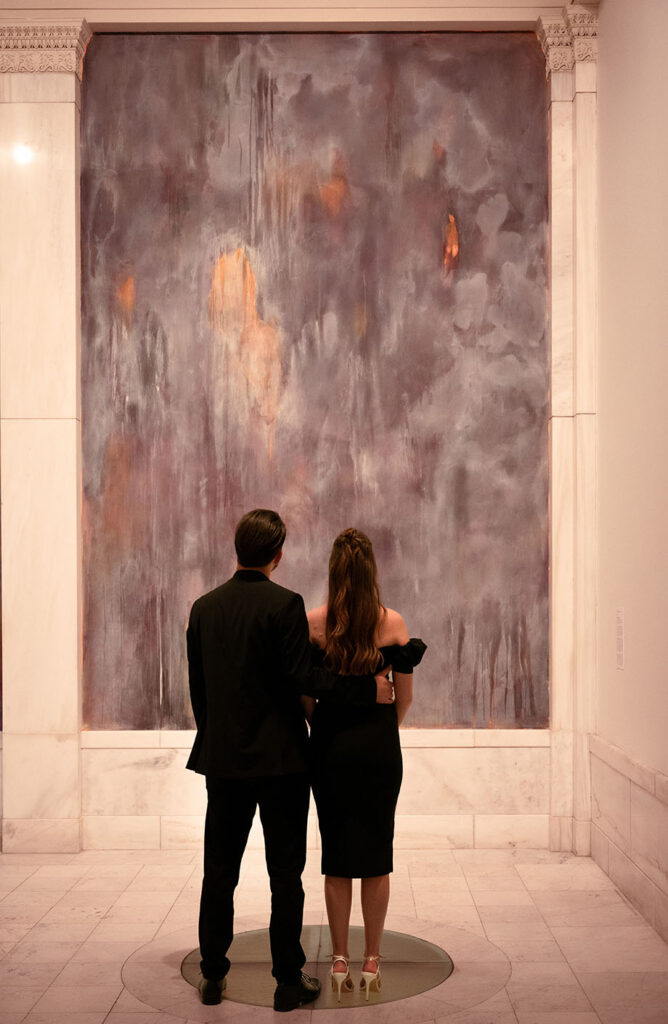 Couple looking at art in Pittsburgh Carnegie museum of art