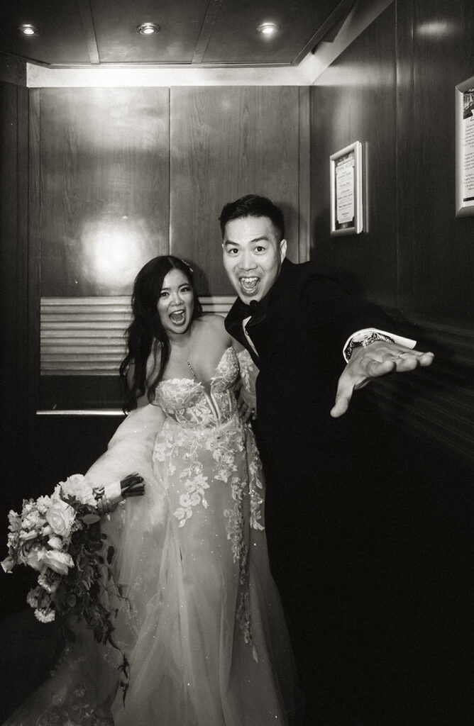 Bride and Groom at an elevator during their wedding at the Arcade