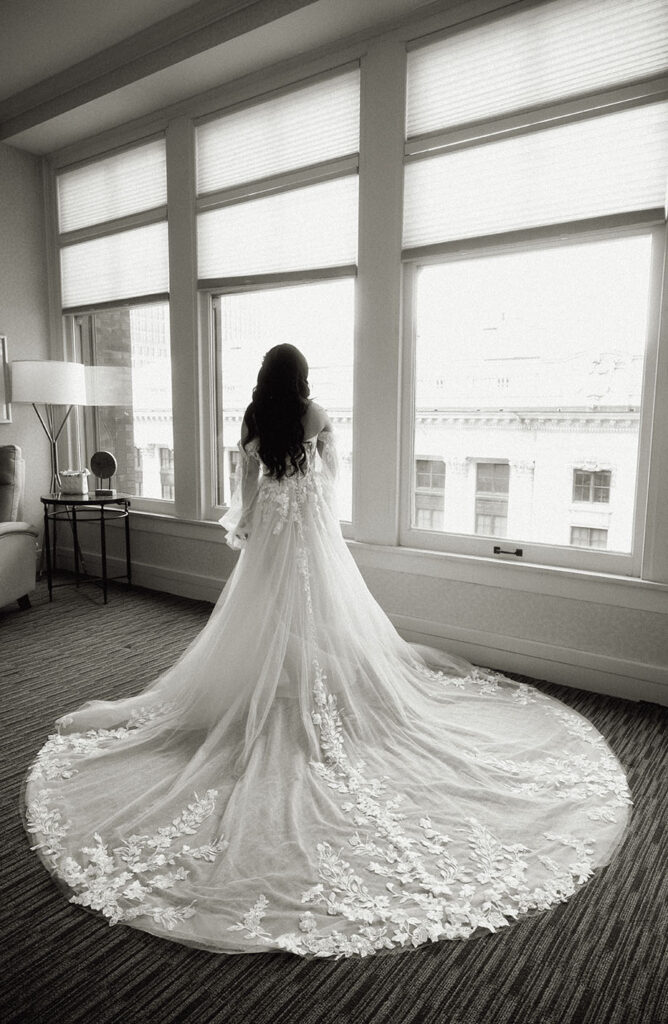 Bride facing out showing off her wedding dress train