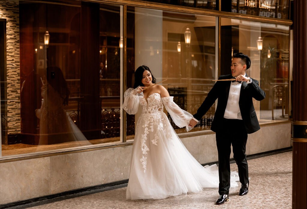 Bride and Groom Walking Down the Arcade Hallway