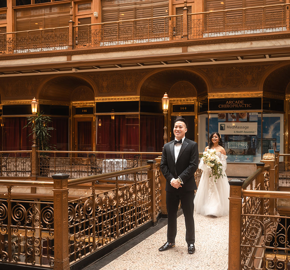 Bride walks towards Groom during First Look at the Arcade Wedding in Cleveland