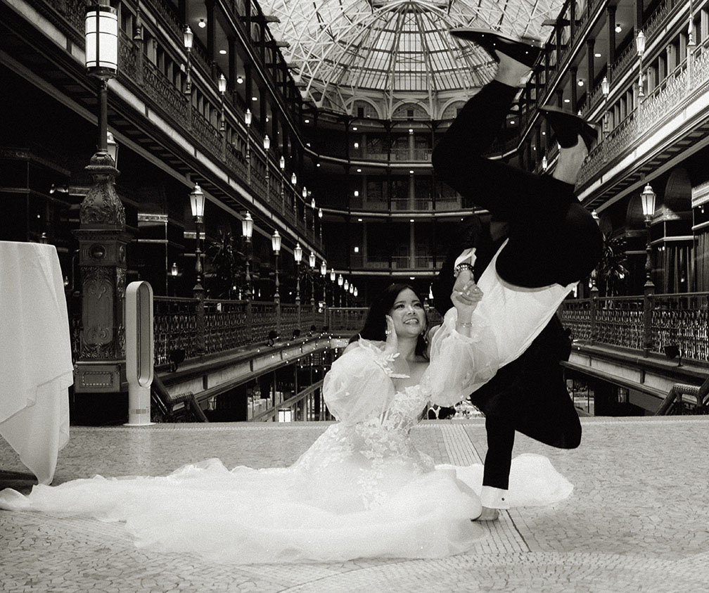 Groom Dancing while Bride holds him