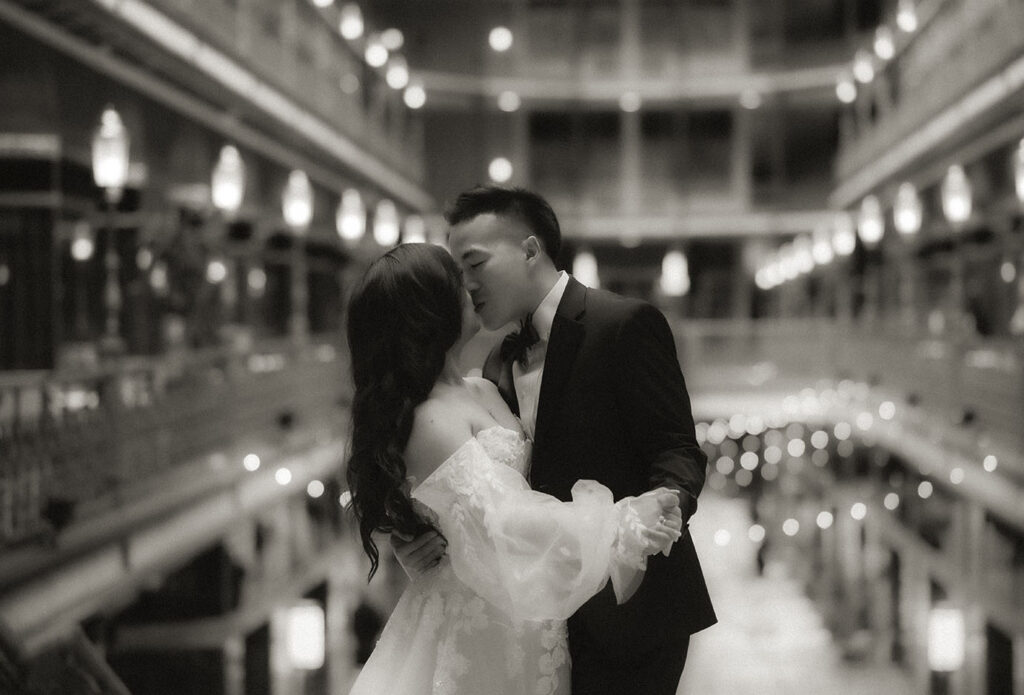 BW Bride and Groom Kiss at the Arcade