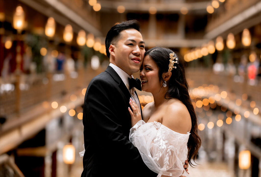 Bride and Groom laughing after first look at the arcade