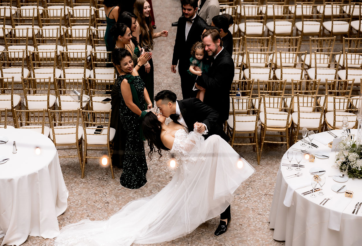 Groom and Bride kiss at the Arcade Wedding