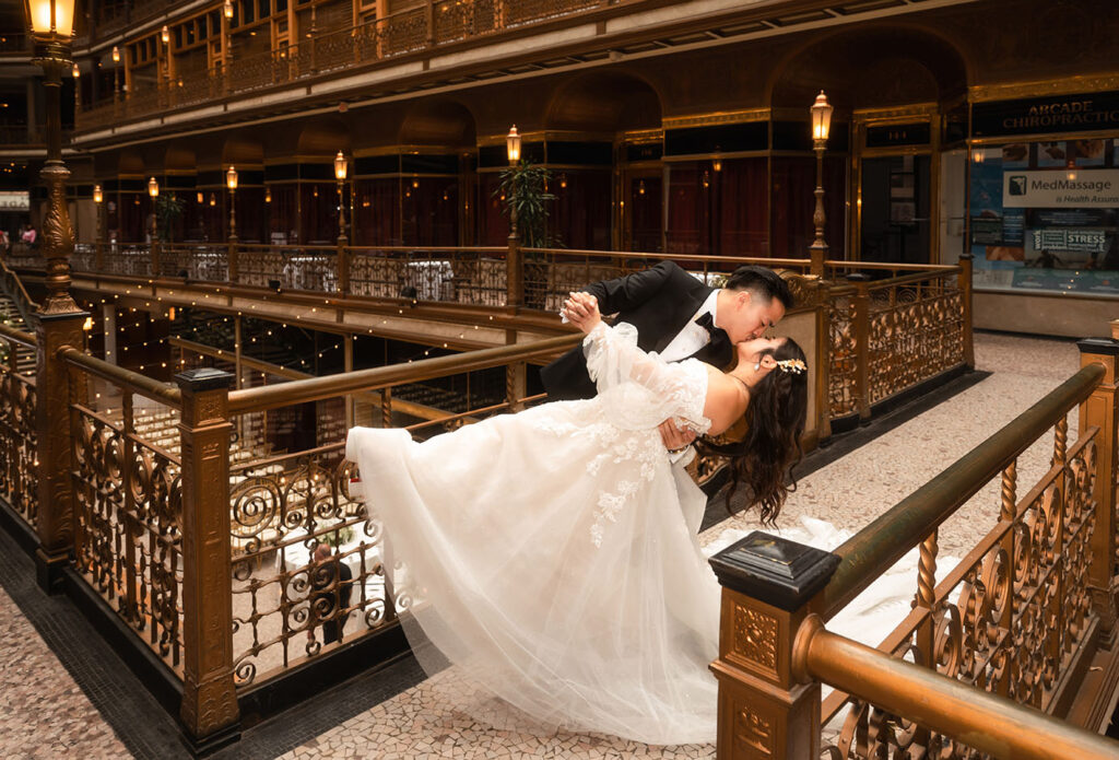 Bride and Groom Kiss at the Arcade Wedding