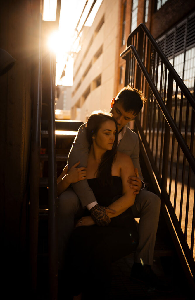 Couple Sitting in an alley in Pittsburgh Strip District