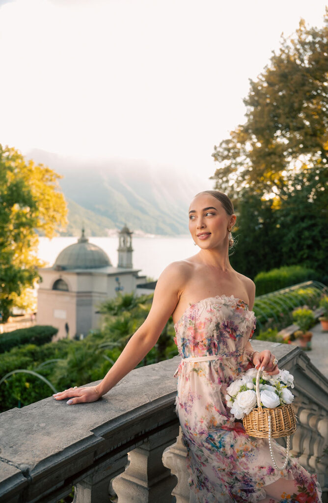 Young Woman in front of green plants at Villa Carlotta in Lake Como